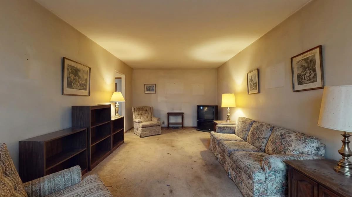 A plain, dated living room before AI redesign