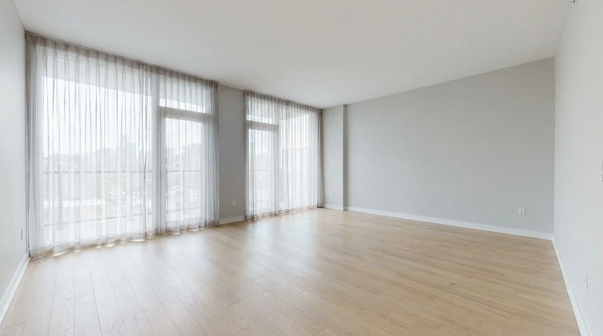 Empty unfurnished living room shared by an e-design client